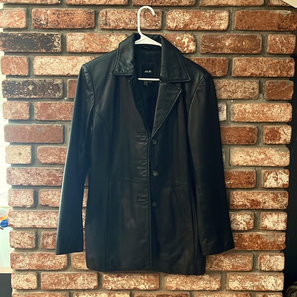 This is a New York black leather jacket in mint condition.